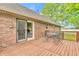 The wooden deck has an outdoor table and chairs, ideal for entertaining or relaxing at 1934 Constitution St, Greenfield, IN 46140