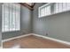 A bedroom with hardwood floors and a high ceiling with wooden beams at 196 E Madison St, Franklin, IN 46131