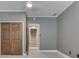 Bedroom with ceiling fan, closet and view to stairway at 196 E Madison St, Franklin, IN 46131