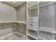 Walk-in closet featuring adjustable shelving and two storage drawers at 196 E Madison St, Franklin, IN 46131