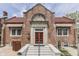 Charming brick building featuring a red door and decorative architectural details, creating an inviting and historical facade at 196 E Madison St, Franklin, IN 46131