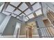 Bright foyer featuring a coffered ceiling, neutral walls, hardwood floors, and a staircase at 196 E Madison St, Franklin, IN 46131