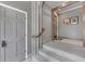 Welcoming foyer featuring elegant tile flooring, neutral walls, and a classic staircase with decorative wood trim at 196 E Madison St, Franklin, IN 46131