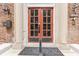 Close-up of a charming red front door with decorative pillars and clear address numbers, enhancing curb appeal at 196 E Madison St, Franklin, IN 46131