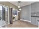 Bright dining room with light fixture, wood floors, and a laundry room through closet doors at 196 E Madison St, Franklin, IN 46131