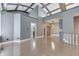 Spacious living room with hardwood floors, vaulted ceilings, and ample natural light, perfect for comfortable living at 196 E Madison St, Franklin, IN 46131