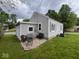 Backyard with gravel patio, outdoor seating, and well-maintained grass at 209 N Lincoln St, Martinsville, IN 46151