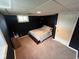 Finished basement bedroom with dark blue walls, carpeted floor, and egress window at 209 N Lincoln St, Martinsville, IN 46151
