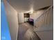 Unfinished basement with stairs, washer, dryer, and small TV at 209 N Lincoln St, Martinsville, IN 46151
