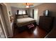 Comfortable bedroom featuring hardwood floors, ceiling fan, dresser and natural light from windows at 209 N Lincoln St, Martinsville, IN 46151