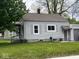 Exterior elevation with landscaped yard and gray siding at 209 N Lincoln St, Martinsville, IN 46151