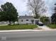 Charming single-story home with well-maintained lawn and attached garage providing extra parking at 209 N Lincoln St, Martinsville, IN 46151