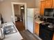 Practical kitchen featuring modern appliances, light countertops and wood cabinets at 209 N Lincoln St, Martinsville, IN 46151