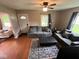 Inviting living room with hardwood floors, comfortable seating, and plenty of natural light at 209 N Lincoln St, Martinsville, IN 46151