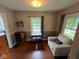 Inviting living room nook with a comfortable chair, small desk, and natural light at 209 N Lincoln St, Martinsville, IN 46151