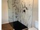 Modern bathroom with a frameless glass shower featuring decorative marble-like tiles at 223 E Fordice St, Lebanon, IN 46052