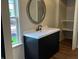 Bathroom showcasing new vanity with modern finishes and a view to the outside at 223 E Fordice St, Lebanon, IN 46052
