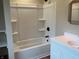Bathroom featuring modern vanity, bathtub with tile surround and shelving at 223 E Fordice St, Lebanon, IN 46052