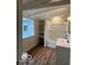 Bright bathroom with a window, modern vanity, shelving, and a shower-tub combo at 223 E Fordice St, Lebanon, IN 46052