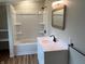 Bathroom featuring a shower-tub combo and a modern vanity with black hardware at 223 E Fordice St, Lebanon, IN 46052