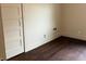 Bedroom features hardwood floors, neutral paint, white baseboards and a vintage door at 223 E Fordice St, Lebanon, IN 46052