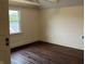 Bedroom with hardwood floors, window with view, neutral paint and traditional door at 223 E Fordice St, Lebanon, IN 46052