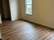 Bedroom featuring new flooring and natural light from a large window at 223 E Fordice St, Lebanon, IN 46052