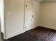 Bedroom with hardwood floors, neutral paint, and traditional door at 223 E Fordice St, Lebanon, IN 46052