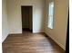 Bedroom featuring new flooring and natural light from a window at 223 E Fordice St, Lebanon, IN 46052