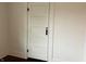 Vintage paneled door with black hardware against neutral paint at 223 E Fordice St, Lebanon, IN 46052