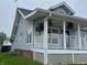 Charming two-story home featuring a welcoming covered porch at 223 E Fordice St, Lebanon, IN 46052