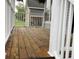 Cozy front porch with wooden flooring and white railings at 223 E Fordice St, Lebanon, IN 46052