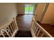 Hallway featuring wood floors, staircase, and sliding doors leading to the outdoor space at 223 E Fordice St, Lebanon, IN 46052