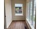 Hallway with hardwood floors and lots of natural light shining through large windows at 223 E Fordice St, Lebanon, IN 46052