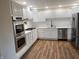 Bright and spacious kitchen featuring white cabinets, stainless steel appliances, and stylish countertops at 223 E Fordice St, Lebanon, IN 46052