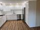 Beautiful kitchen with white cabinetry, modern stainless steel appliances, and elegant countertops at 223 E Fordice St, Lebanon, IN 46052