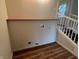Functional laundry area with shelving, hookups, and wood-look flooring at 223 E Fordice St, Lebanon, IN 46052