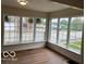 Bright sunroom with large windows offering ample natural light and street views at 223 E Fordice St, Lebanon, IN 46052