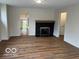 Living room showcasing new flooring and a fireplace, with access to additional rooms at 223 E Fordice St, Lebanon, IN 46052