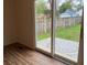 Bright living room featuring wood floors and large sliding doors to backyard patio at 223 E Fordice St, Lebanon, IN 46052