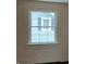 Picture of a room with window looking out onto neighboring home at 223 E Fordice St, Lebanon, IN 46052