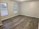 Bedroom featuring hard surface floors, neutral colored walls and two windows at 2327 Bristol Dr, Franklin, IN 46131