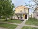 Two-story home featuring a manicured lawn, inviting front porch with chairs, and professional landscaping at 2327 Bristol Dr, Franklin, IN 46131
