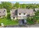 Elevated aerial view of townhome with a two-car garage and mature landscaping at 2430 Spring Hill Ct, Indianapolis, IN 46268