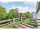 Cozy wooden back deck with scenic views of the lush backyard and mature trees at 2430 Spring Hill Ct, Indianapolis, IN 46268