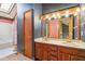 Bathroom with double sink vanity, tiled walls, and tub and shower combo at 2430 Spring Hill Ct, Indianapolis, IN 46268