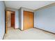Standard bedroom with one window, closet with bi-fold doors and a decorative border at 2430 Spring Hill Ct, Indianapolis, IN 46268