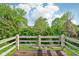 Wood deck with wood railing and a view of the backyard at 2430 Spring Hill Ct, Indianapolis, IN 46268