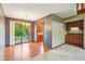 Dining area with hardwood floors and a sliding glass door leading to a stone patio at 2430 Spring Hill Ct, Indianapolis, IN 46268