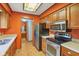 Functional kitchen with stainless steel appliances and tile flooring at 2430 Spring Hill Ct, Indianapolis, IN 46268